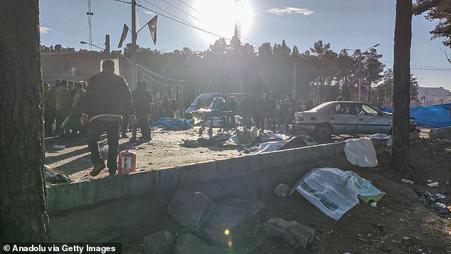 Iran Cemetery Shooting: Details Behind the Deadly Commemoration Incident 79573151 12927027 a view of the scene after explosions near gen qassem soleimani s a 2 1704385745440.jpg